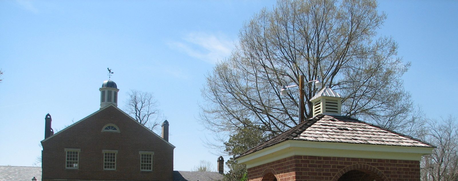 Historic Port Tobacco courthouse in Charles County, Maryland, under a clear blue sky