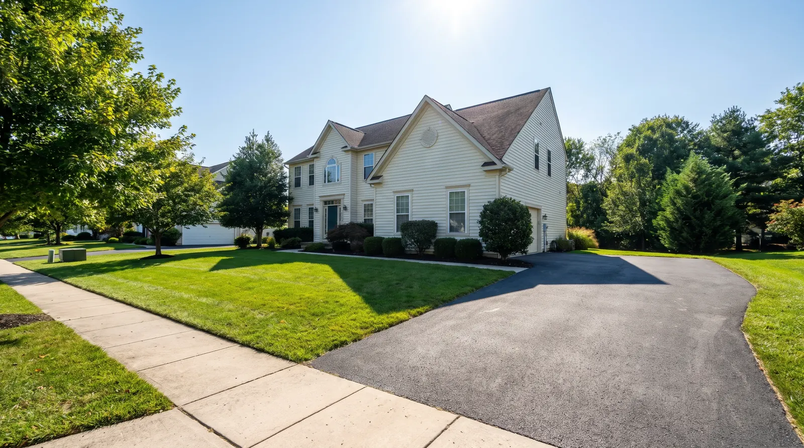 Exterior of a two-story suburban Maryland home on a sunny day, as photographed for a field inspection